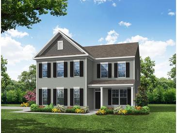 Charming two-story home with gray siding, black shutters, and a well-manicured lawn at 238 Silk Oak Dr, Moncks Corner, SC 29461