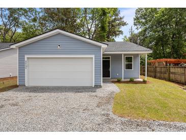 Charming one-story home featuring blue siding, a one-car garage, and a gravel driveway at 4013 B Ladson Rd, Ladson, SC 29456