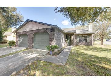 Charming brick home with an attached two-car garage and well-maintained lawn at 804 Temple Rd # B, Ladson, SC 29456