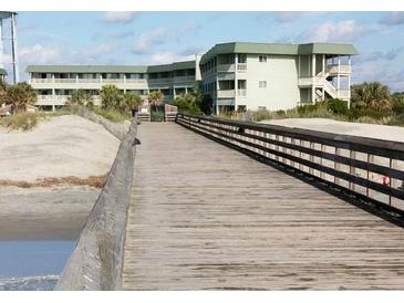 Charming condos with balconies, beach access via boardwalk, and lush landscaping at 1300 Ocean Blvd # 308, Isle of Palms, SC 29451