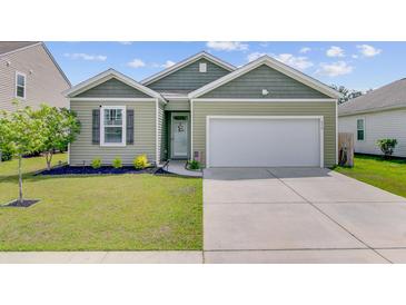 Charming home with manicured lawn, attached garage and delightful curb appeal at 212 Rubles Ln, Moncks Corner, SC 29461