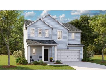 Charming two-story home with light blue siding and a welcoming front porch at 1023 Swamp Rose Run, Summerville, SC 29485