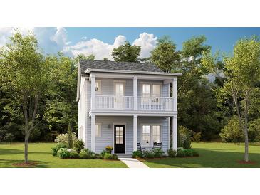 Charming two-story home with a welcoming front porch and a second-story balcony at 1425 Clay Field Trl, Summerville, SC 29485