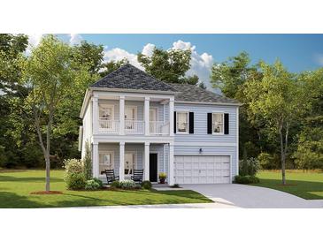 Charming two-story home featuring a covered porch, attached garage, and professionally landscaped yard at 157 Threaded Fern St, Summerville, SC 29485