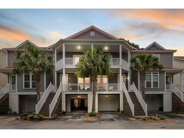 Charming gray townhouse with double balconies, stairs, and palm trees in front at 3019 Fraserburgh Way, Mount Pleasant, SC 29466