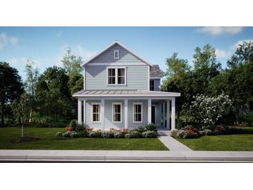 Charming two-story home featuring a welcoming front porch and beautiful landscaping at 778 Clay Field Trl, Summerville, SC 29485