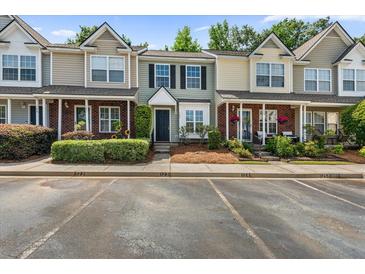 Townhouse exterior featuring well-maintained landscaping, brick accents, and a private entrance at 122 Hornby Cir, Goose Creek, SC 29445