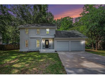 Charming two-story home with gray painted brick and an attached two-car garage at 7993 Malden Ave, North Charleston, SC 29420