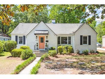 Charming painted brick home featuring a walkway to the front door and manicured landscaping at 4503 Overbrook Ave, North Charleston, SC 29405