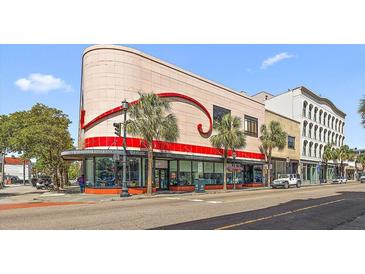 Unique building on city street with red accent and trees for character at 517 King St # 13, Charleston, SC 29403