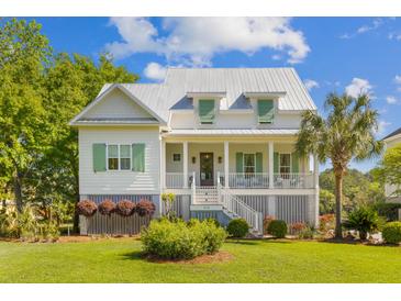 Charming two-story home features a welcoming front porch, well-manicured lawn, and mature landscaping at 112 Berkshire Dr, Wando, SC 29492