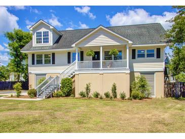 Charming two-story home featuring a welcoming front porch and stairs leading to the entrance at 1834 Cornish Ave, Charleston, SC 29412
