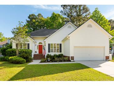 Charming one-story home with a well-manicured lawn, brick entryway, and a bright red front door at 1971 N Smokerise Way, Mount Pleasant, SC 29466