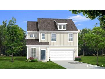 Charming two-story home featuring classic design elements and a well-manicured lawn at 406 Cadbury Loop, Summerville, SC 29486