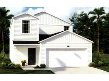 Charming two-story home featuring white siding, a front-facing garage, and a well-manicured lawn at 511 Kitsap Ct, Summerville, SC 29486