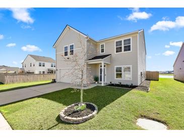 Charming two-story home with a well-maintained lawn and classic siding under a clear blue sky at 142 Lucca Dr, Summerville, SC 29486