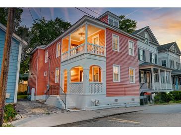 Charming two-story home with a welcoming porch and fresh exterior paint at 15 Dewey St, Charleston, SC 29403