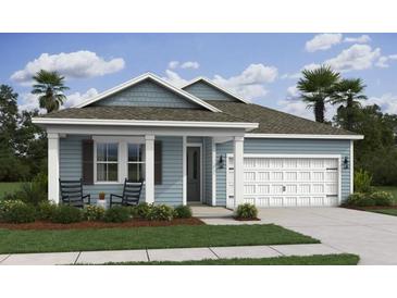 Charming single-story home with blue siding, a two-car garage, covered porch, and well-manicured lawn at 2034 Mcguire Ln # 009, Hollywood, SC 29449