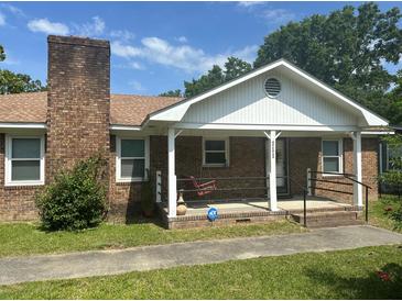Charming brick home with a cozy front porch and classic design, perfect for relaxing in the outdoors at 111 Craven Rd, Ladson, SC 29456