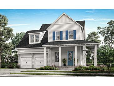 Charming two-story home with white siding, blue shutters, a welcoming front porch and a two car garage at 217 Clearpath Dr, Summerville, SC 29486