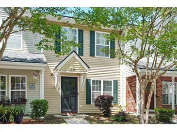 Charming two-story townhome with traditional architecture, green shutters and a well maintained lawn at 224 Jackson St, Goose Creek, SC 29445