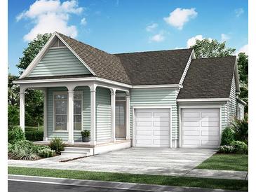 Charming craftsman-style home with covered porch, two-car garage, and beautifully landscaped front yard at 366 Trailmore Ln, Summerville, SC 29486
