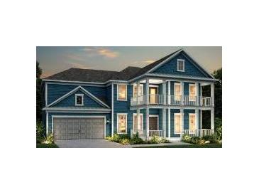 Charming two-story blue home featuring a double porch, attached garage, and well-maintained landscaping at 4272 Hugh Bennett Dr, Johns Island, SC 29455