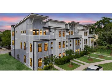Charming townhome features modern architectural details and well-maintained landscaping at 4414 Avery Ave, North Charleston, SC 29405