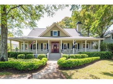 Charming home featuring a welcoming front porch, manicured landscaping, and an inviting entrance at 707 Royall Ave, Mount Pleasant, SC 29464