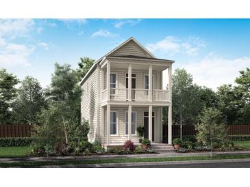 Charming two-story home features a double porch and beautifully landscaped front yard at 712 Rumbling Leaf Ln, Summerville, SC 29486