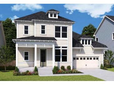 Charming two-story home with a well-manicured lawn, attached garage, and classic architectural details at 1159 Reserve Ln, Awendaw, SC 29429