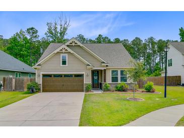 Charming single-story home with a well-manicured lawn and a two-car garage at 219 Whirlaway Dr, Moncks Corner, SC 29461