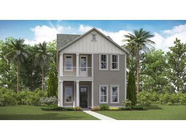 Charming two-story home featuring a welcoming front porch and a classic gray and white color scheme at 314 Archar St, Summerville, SC 29486