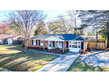 Charming brick home with a well-maintained front yard and inviting curb appeal at 4437 Garwood Dr, Ladson, SC 29456