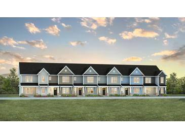 Charming new townhomes with modern design features and colorful exteriors under a cloudy sky at 561 Gahagan Rd, Summerville, SC 29486