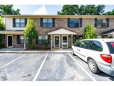 Brick townhome with black shutters, well-maintained landscaping, and ample parking at 6279 Lucille Dr # B, North Charleston, SC 29406