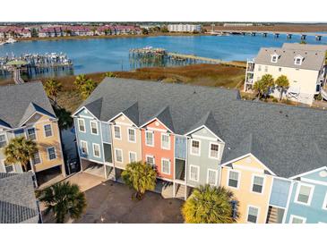Beautiful multi-colored townhouse exteriors with modern architectural details and harbor views at 81 Sandbar Ln # 19, Folly Beach, SC 29439