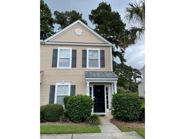 Charming two-story townhome with black shutters and a cozy entrance at 9010 Maple Grove Dr, Summerville, SC 29485