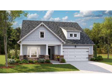 Charming single Gathering home featuring stone accents, neutral siding, a manicured lawn and a two car garage at 1037 Tulip Shell St, Summerville, SC 29485