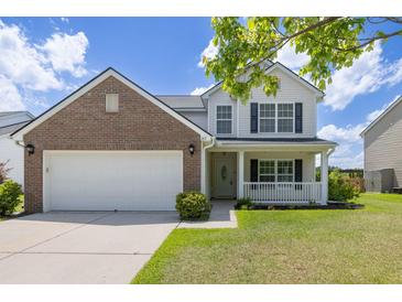 Charming two-story home with a brick facade, a well-manicured lawn, and a welcoming front porch at 167 Decatur Dr, Summerville, SC 29486