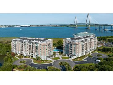Stunning aerial view of waterfront condos, bridge, and manicured landscaping at 222 S Plaza Ct, Mount Pleasant, SC 29464