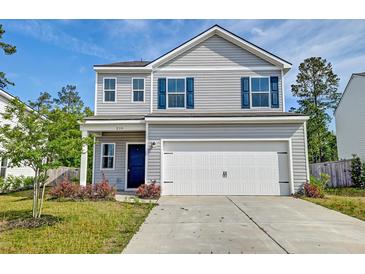 Charming two-story home with gray siding, blue shutters, and a two-car garage under a bright blue sky at 239 Parkwood Vista Way, Summerville, SC 29486