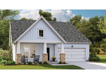 Charming single-story home with a welcoming front porch and manicured lawn at 332 Pine Crest View Dr, Summerville, SC 29486