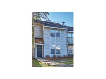 Charming townhouse featuring a classic exterior with a private entrance and ample natural light at 4652 Nibbs Ln, North Charleston, SC 29418