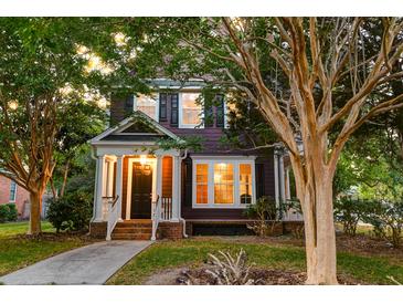 Charming two-story home with a well-maintained front yard and inviting front porch at 321 Bounty Ln, Charleston, SC 29412