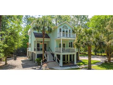 Charming two-story home with landscaped yard and double balconies, perfect for enjoying the coastal breezes at 3738 Station Point Ct, Mount Pleasant, SC 29466