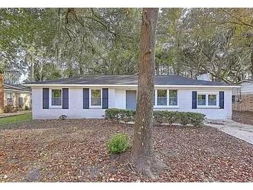 Charming single-story home with mature trees and a well-maintained front yard at 960 Savage Road Rd, Charleston, SC 29414