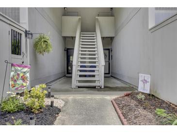 Charming condo entrance with stairs and walkway leading to the front door at 807 Greencastle Dr, Goose Creek, SC 29445