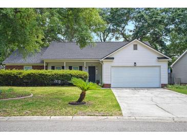 Charming single-story home with well-manicured lawn and attached two-car garage at 109 New Spring Ct, Summerville, SC 29485