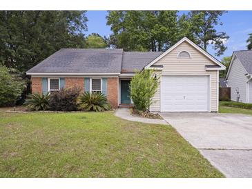 Charming single-story home featuring a brick facade, blue shutters, and a well-maintained front yard at 111 Macfarren Ln, Summerville, SC 29485